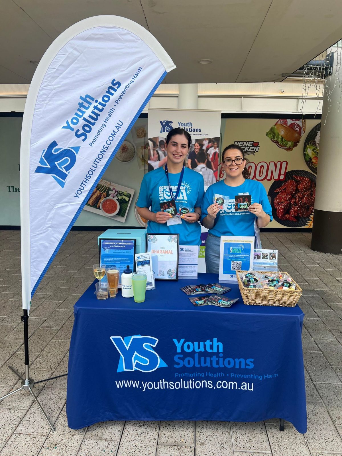 Youth Solutions staff and volunteers at a community outreach stall.